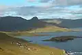 View over the bay of Tjaldavík, Øravík and Trongisvágur. A part of Øravík is visible just below the mountain Oyrnafjall.