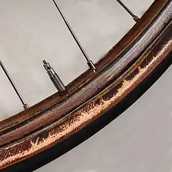 Wooden bicycle rim with tubular tyre and a Presta valve
