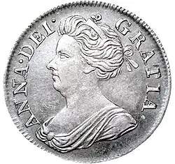 Silver coin showing a depiction of a woman's head and shoulders