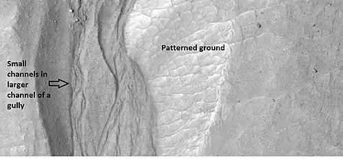 Close-up of gully showing multiple channels and patterned ground, as seen by HiRISE under the HiWish program. Locations is Phaethontis quadrangle.