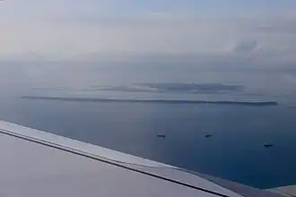 Pelumpong Spit (foreground) and PMB seen from a commercial aircraft in 2023