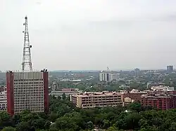 Distant photo of building complex with tower