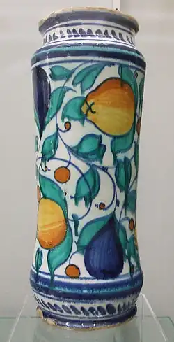 An albarello (drug jar) from Venice or Castel Durante, 16th century. Around 30 cm high. Decorated in cobalt blue, copper green, antimony yellow, and yellow ochre. Burrell Collection