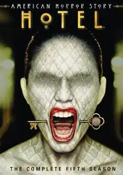 DVD cover art for AHS Hotel, showing a woman screaming with a key stuck from her cheeks.