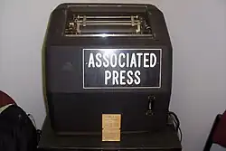 Vintage teletype machine labeled "Associated Press"