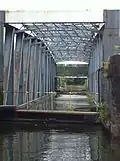 Two barriers are extended across the Bridgewater Canal before the bridge is swung. Here the inner barrier is only extended part way