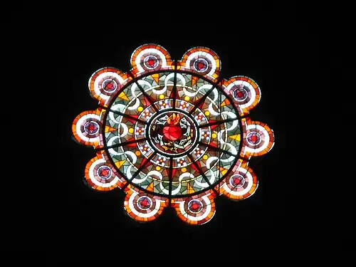A rose window depicting the Sacred Heart of Christ