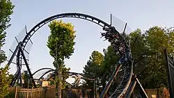 Photo of Batman Gotham City Escape, showing its first inversion, a counter-clockwise corkscrew leading into the roller coaster's second LSM launch.