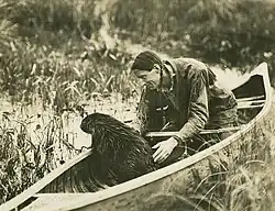 Grey Owl in a canoe.