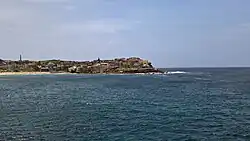 Ben Buckler, from the south. The Bondi Sewer Vent can be seen behind the beach area.
