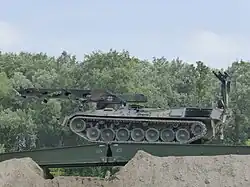A Biber of the German Army using its own bridge