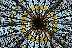 chrysanthemum-style domed glass roof window with yellow and white petal rings