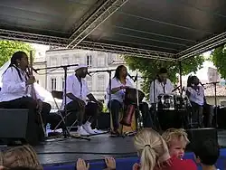 Tillery (center) performing with The Cultural Heritage Choir in July 2008