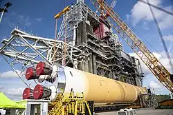 A Space Launch System Rocket Core at Stennis prior to being lifted onto the B2 test stand