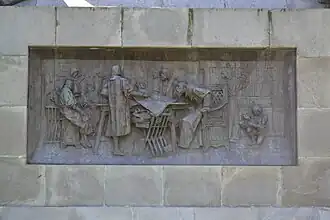 One of the basement's bronze reliefs