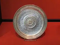 A flat bowl with Latin inscription around the centre