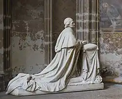 Statue of Desprez kneeling at prayer