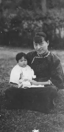 Chen Jieru with daughter Chiang Yao-kuang on her lap, sitting in the grass at Whampoa Military Academy in 1926
