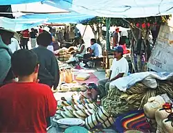 Vendors selling woven goods in the tianguis of Chilapa