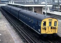 A Class 501 EMU in Rail Blue calling at Harrow and Wealdstone