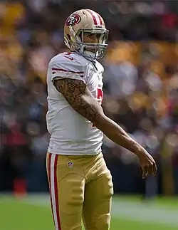 Colin Kaepernick wearing San Francisco 49ers uniform at a game in 2012