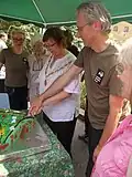 Cutting the cake to celebrate 30 years since site was saved