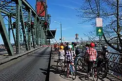 Cyclists waiting during a bridge lift