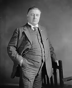 A half-body black and white photograph of Daniel C. Oliver