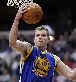 David Lee is with the Golden State Warriors in air with a ball in hand