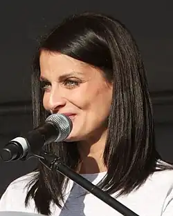 Dayanara Torres in front a microphone