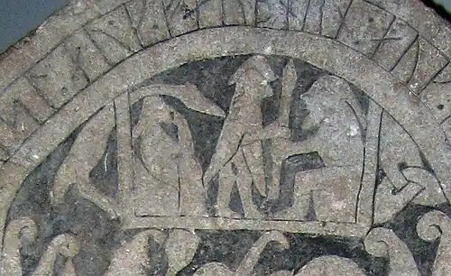 Gotland Runic Inscription 181 depicting a warrior next to a Valkyrie in swan hamr in Valhalla