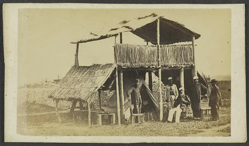 Dry ground must have been a rare luxury — notice where the tent is pitched