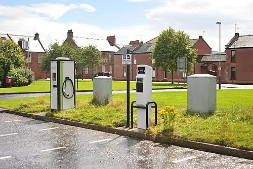 eVolt Tri-Rapid Compact Charger (left) and eVolt Standard Post charger with Type 1 and Type 2 ports in a car park in Arbroath, Scotland (2017)