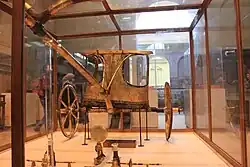 A chariot, reassembled from the pieces in the antechamber