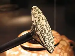 Egyptian disk-shaped macehead, 4000–3400 BCE. At the end of the period, it was replaced by the superior Mesopotamian-style pear-shaped macehead, as seen on the Narmer Palette.[11]