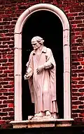 Statue of an elderly man at Sir William Turner's Almhouses