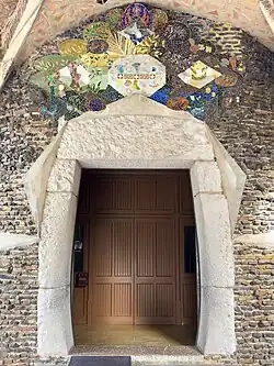Entrance lintel with ceramic decoration representing the four cardinal virtues