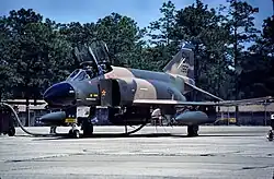An U.S. Air Force McDonnell Douglas F-4 Phantom II pictured at Tinker Air Force Base. On its intake splitter-plate is a kill mark in the form of a red star, signifying an aerial victory achieved during the Vietnam War.