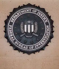 A metal-cast version of the FBI seal at the entrance of the J. Edgar Hoover Building in Washington D.C.