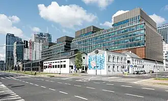 Wola, once an industrial district, is now becoming the business center of the capital.[168] The photo shows the revitalized Norblin Factory.