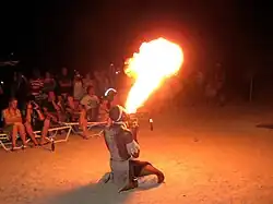A fire breather performing for tourists in Antigua in the Caribbean.