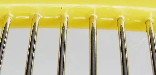 Closeup view of single layer grid: odd and even rods oppositely charged