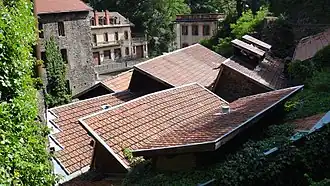 The factory roof seen from a footpath. The May factory is in the background on the right.