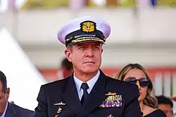 A man in a suit staring forward