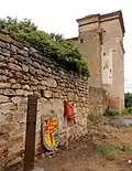 Front of the Palace of Velaz de Medrano (side view) with the plaque, coat of arms of Medrano and royal banner of the Kingdom of Navarre