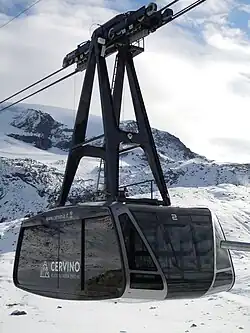 Testa Grigia aerial tramway in Cervinia, Italy, moves skiers to 3480 m glacier.