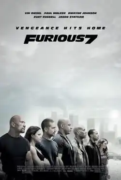 A close up of a car on a desert, with a group of people looking at it from a distance. Above the film's title, the tagline reads "VENGEANCE HITS HOME".