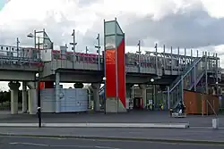 Elevated DLR station, with lift shafts clad in red