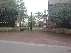 The castle gates, with the lodge visible to the right