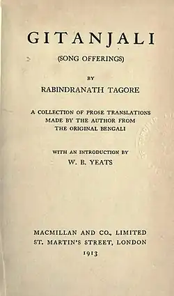 Close-up of yellowed title page in an old book: "Gitanjali (Song Offerings) by Rabindranath Tagore. A collection of prose translations made by the author from the original Bengali with an introduction by W. B. Yeats. Macmillan and Co., Limited, St. Martin's Street, London, 1913."